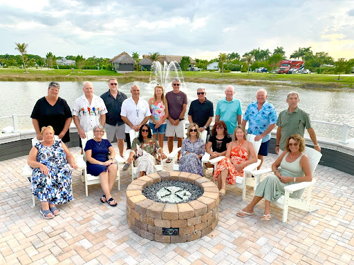 Group of owners at a Class A motorcoach at a luxury motorcoach resort in Fort Myers.