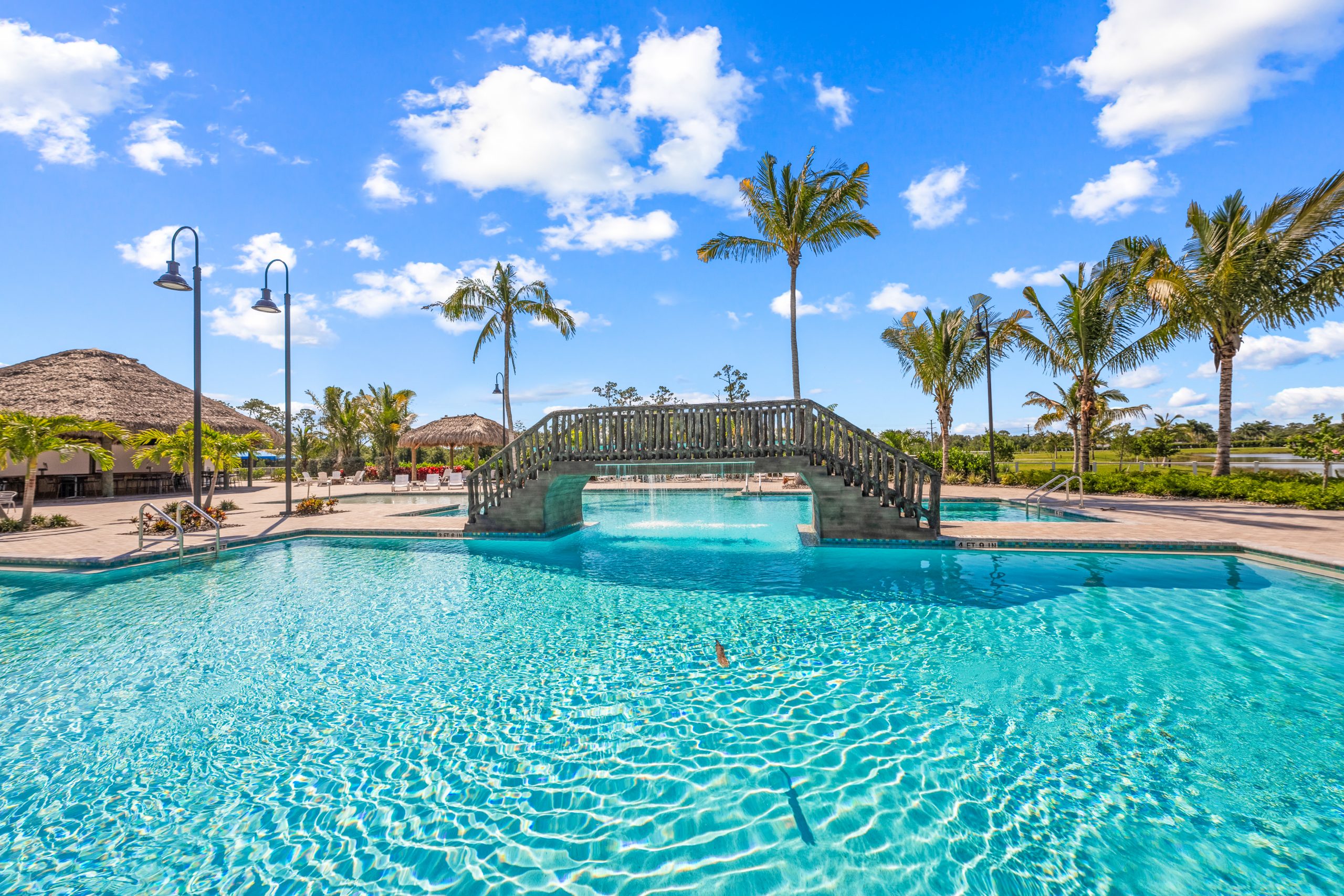 The Coral Club pool bridge at Laguna Caribe, the RV resort compared to a Florida vacation home in this post